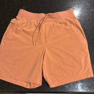 Lululemon tangerine orange Men’s Size M shorts